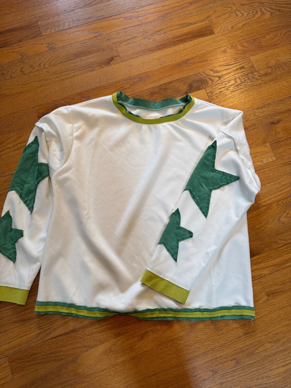 Women’s White Top with Green Star Accents, Size medium